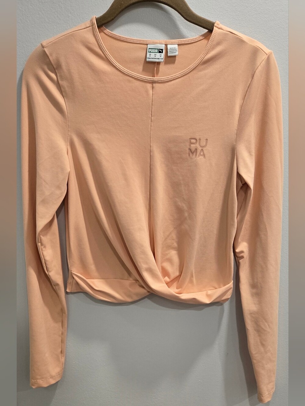 PUMA Infuse Wrap Long Sleeve Cropped Top in Tropical Peach - Size M